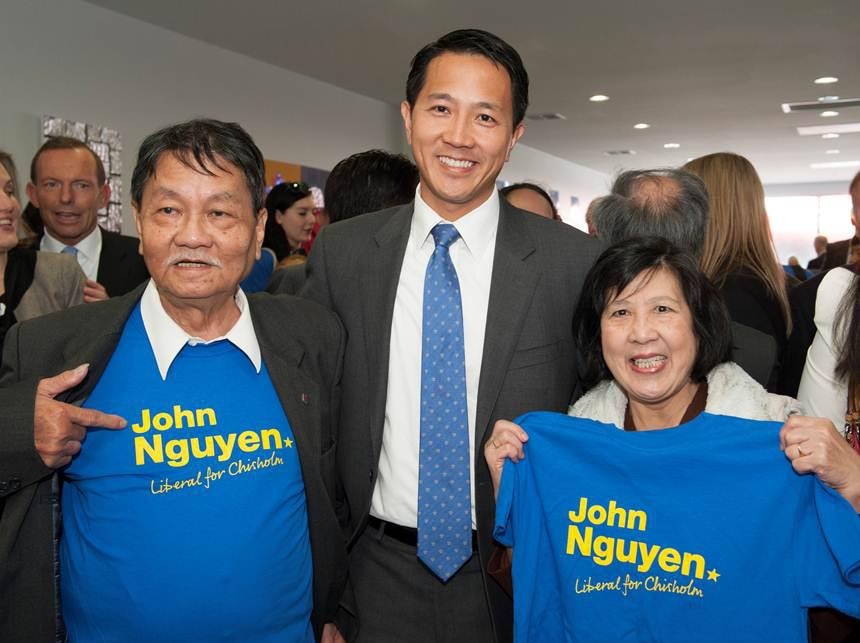 The Liberal candidate for Chisholm, John Nguyen, stands with his parents at a Liberal function in Glen Waverley.