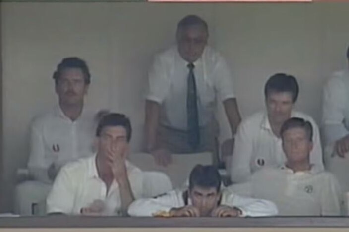 Australian Test players watch from the stands during a match against the West Indies in 1993.