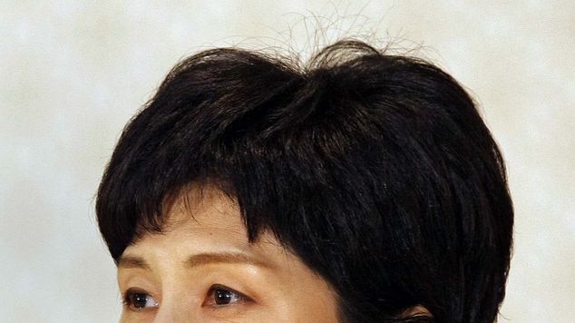 Alleged North Korean spy Kim Hyun-Hee takes part in a press conference