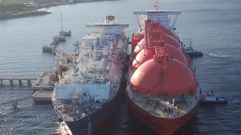 An LNG ship docking beside a floating gas import terminal.