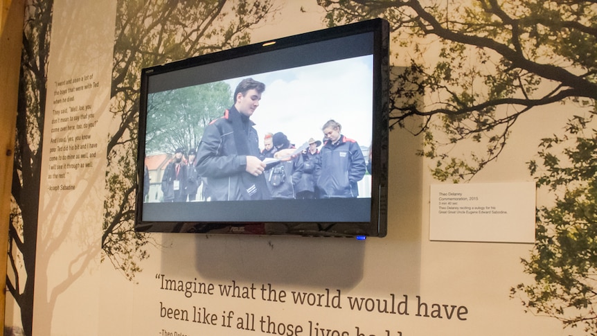 TV screen showing student delivering a eulogy for his Great Great Uncle.