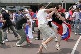 Fans from rival Serbian and Croatian camps clash at Melbourne Park.