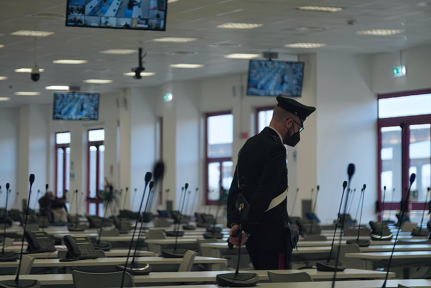 A man walks in the courtroom.