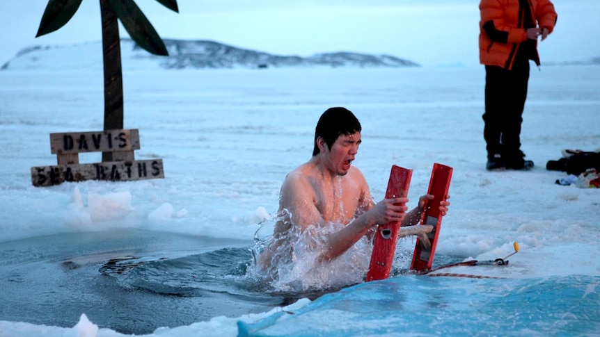 A 'swimmer' emerges from the Davis Sea baths during midwinter's day celebrations in Antarctica.