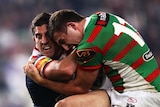 Close affair: Braith Anasta (L) and Sam Burgess tangle in the Roosters' narrow win.