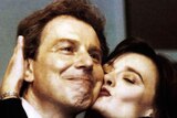 British Labour leader Tony Blair receives a kiss from his wife Cherie