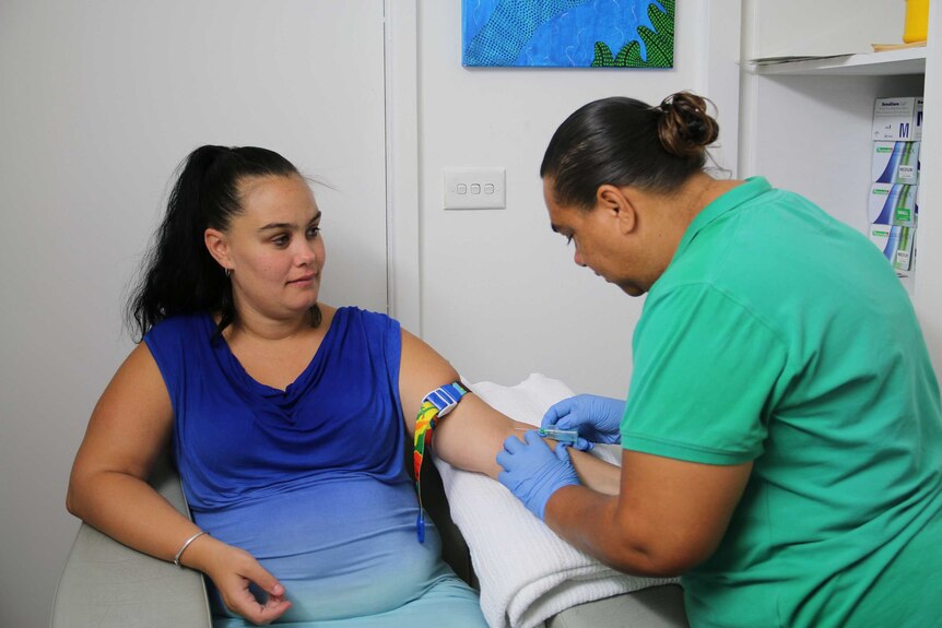 Indigenous Research coordinator Loretta Weatherall collects samples from pregnant mothers.