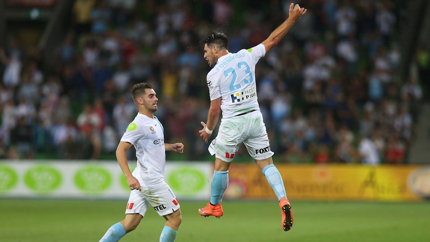 Melbourne City's Bruno Fornaroli (#23, R) celebrates goal with Benjamin Garuccio against Sydney FC.