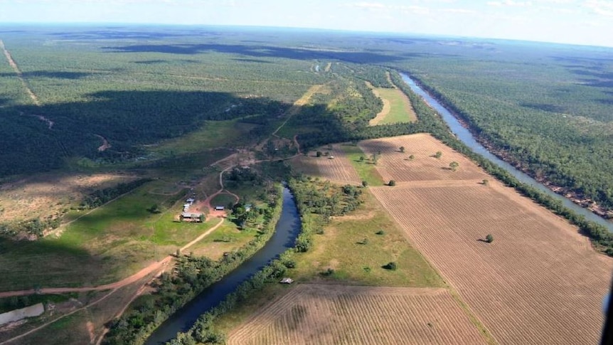 An aerial shot of a homestead and river