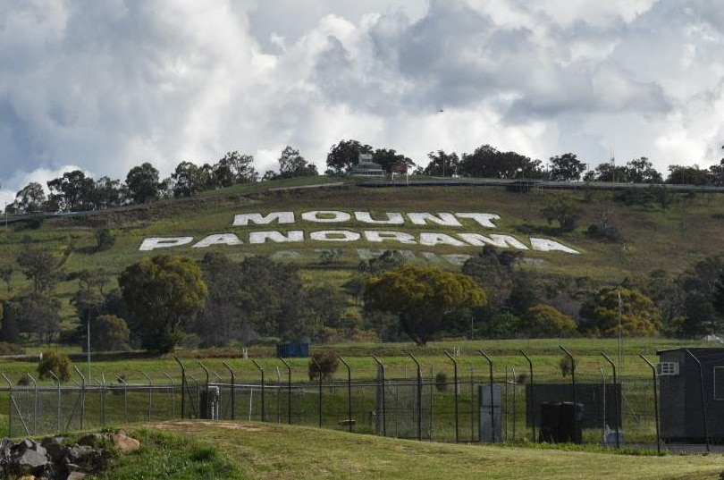 The words 'Mount Panorama' spelled out on the side of the hill from a distance.
