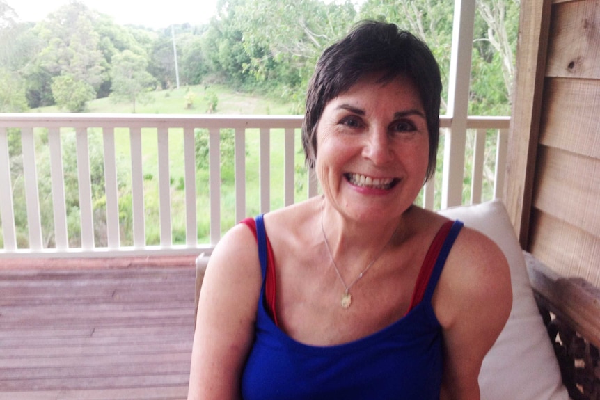 Cancer patient Judith McIntyre smiling at camera.