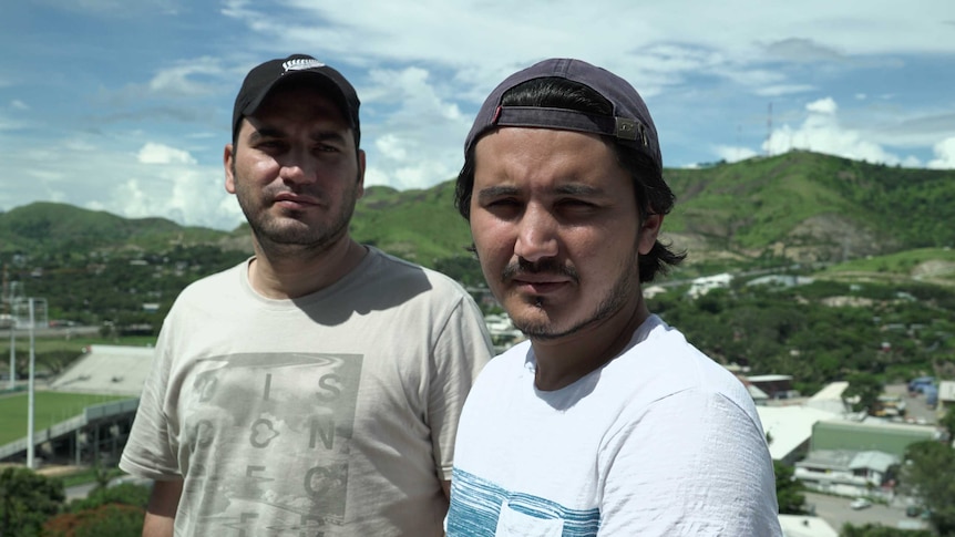 Samar and Zalman stand on a hill in Port Moresby