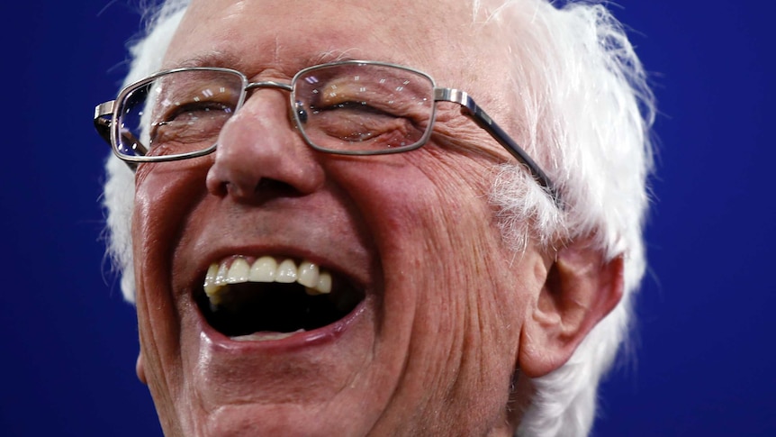 Democratic presidential candidate Sen. Bernie Sanders grins
