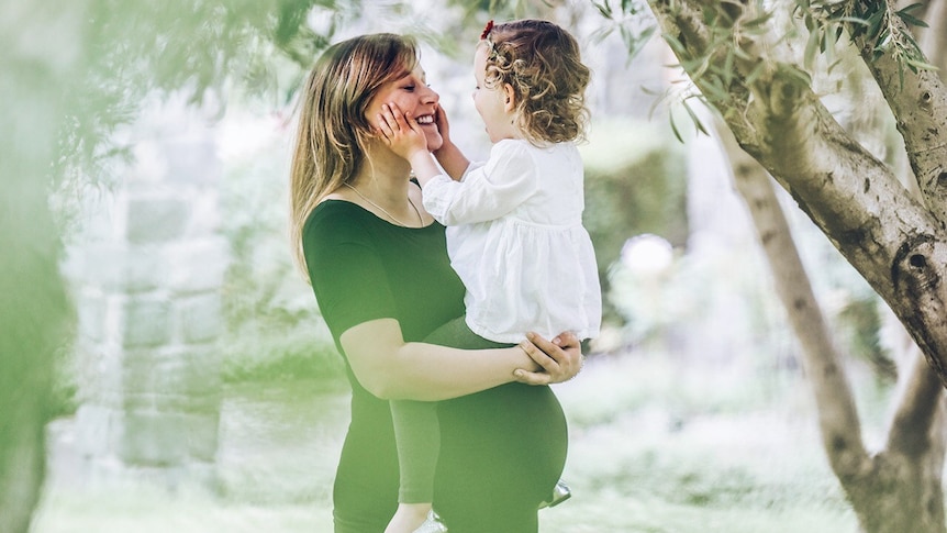 Anne-Marie Brownhill hugs her toddler daughter to depict the toughest and most rewarding parts of parenting.
