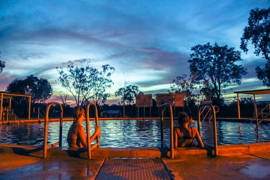 Bathers enjoy sunset at the Lightning Ride bore baths.