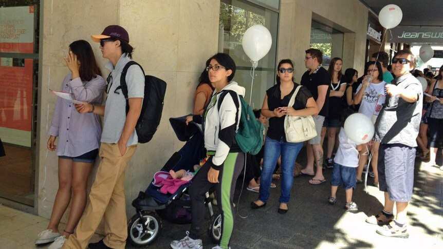 Shoppers queue in Perth
