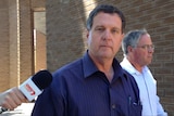 Picture of Stephen John Landless looking at the camera walking out of Bunbury Magistrates Court