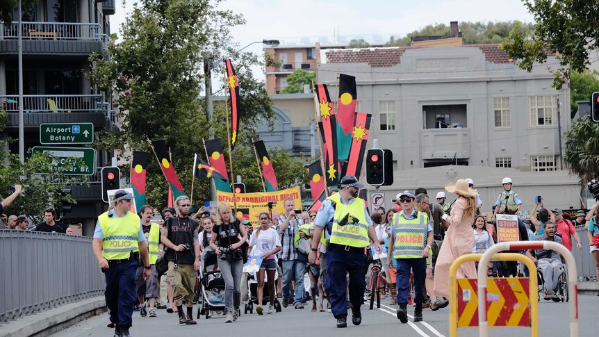 Hundreds march through the streets of Redfern on the 11th anniversary of 'TJ' Hickey's death, February 14, 2015.