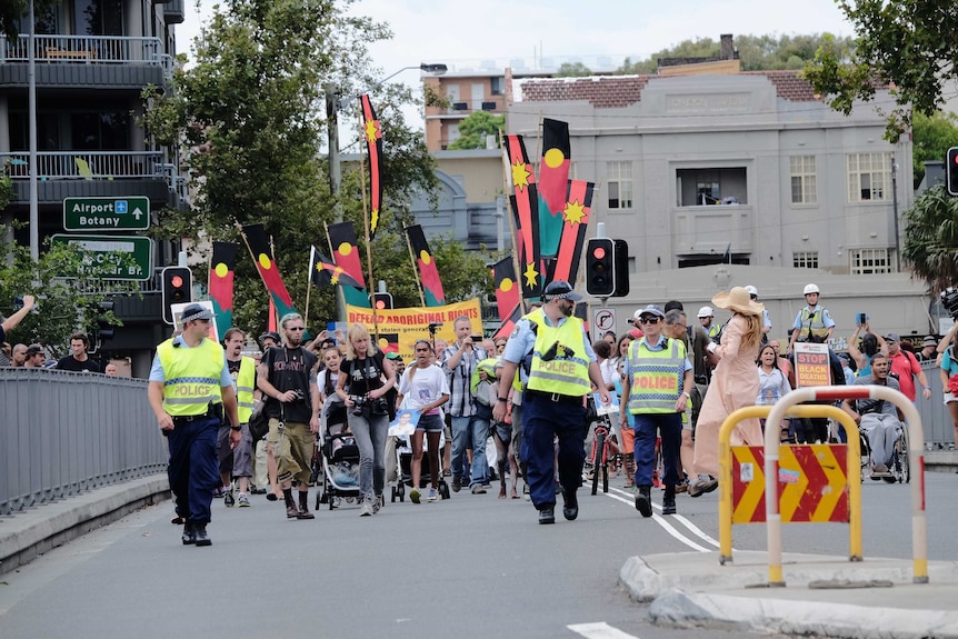 Hundreds march through the streets of Redfern on the 11th anniversary of 'TJ' Hickey's death, February 14, 2015.