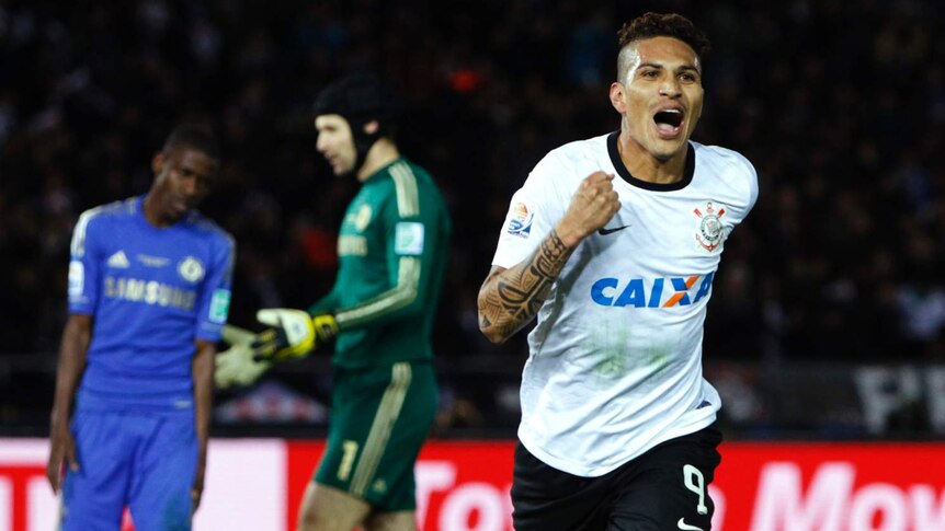 Paolo Guerrero (R) scores the winning goal for Corinthians in the Club World Cup final in Japan.
