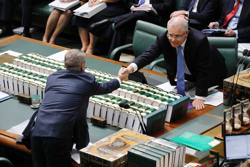 Prime Minister shakes the hand of Bill Shorten in the Reps chamber