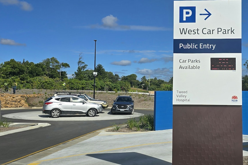 Three cars parked on a round about because there is a lack of car parking spaces at Tweed Valley Hospital.