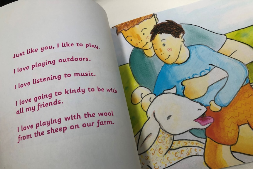 A sotry book with red lettering on the left and illustration on the right page of man holding up a child near a sheep