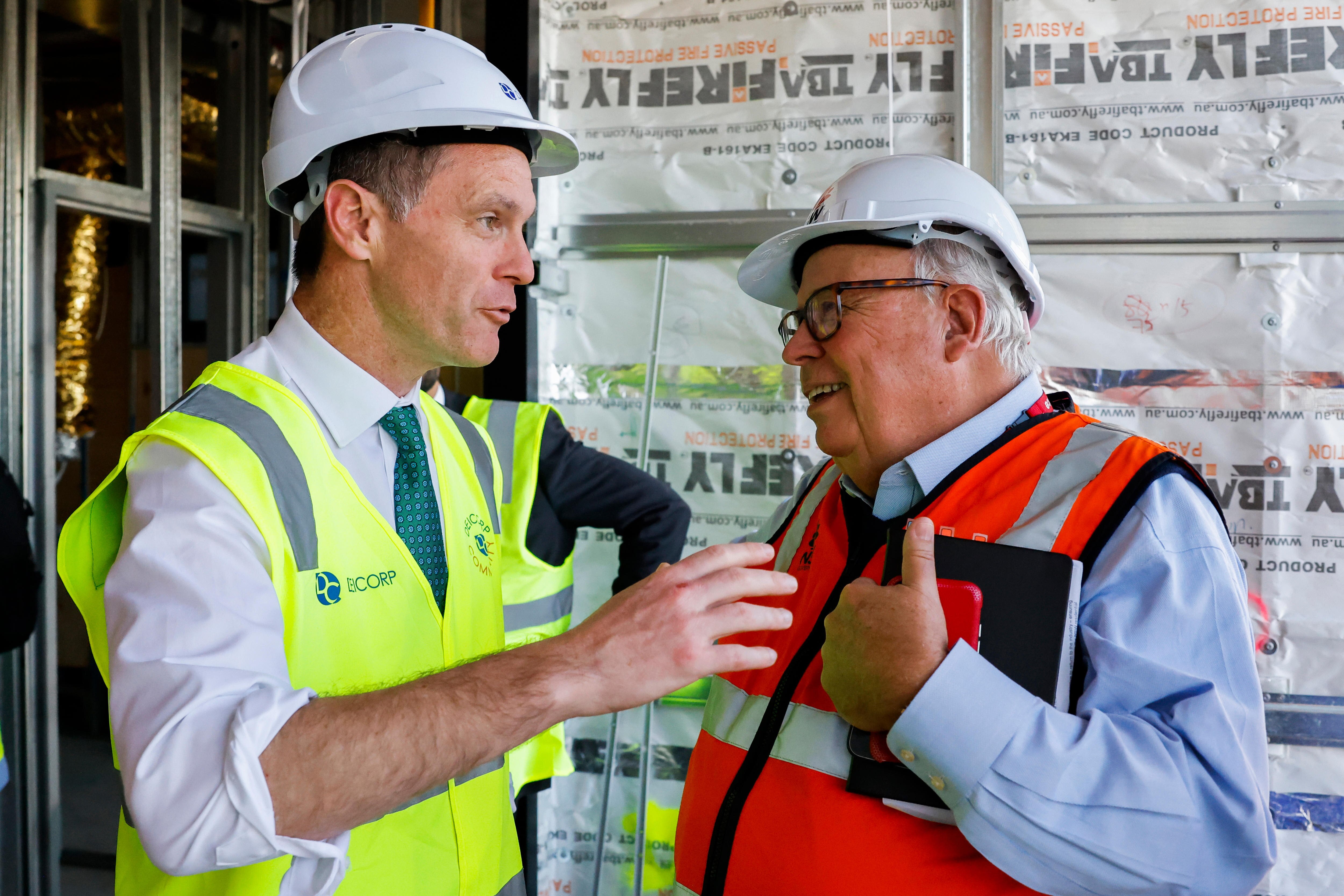 New South Wales Premier Chris Minns talks to New South Wales Building Commissioner David Chandler on tuesday may 16
