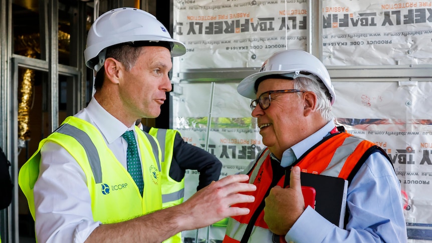 New South Wales Premier Chris Minns talks to New South Wales Building Commissioner David Chandler on tuesday may 16