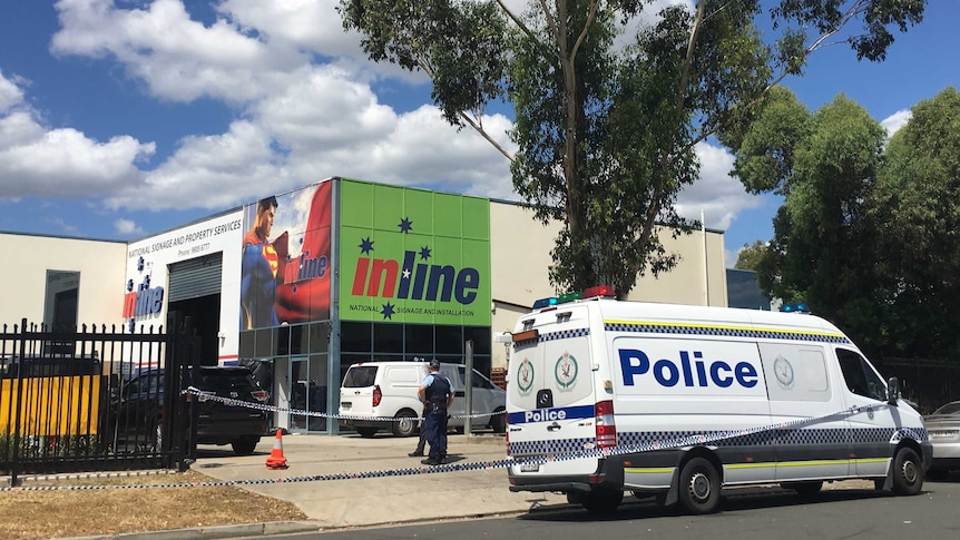 The signage company in Ingleburn which was the site of a triple shooting and siege yesterday.