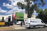 The signage company in Ingleburn which was the site of a triple shooting and siege yesterday.