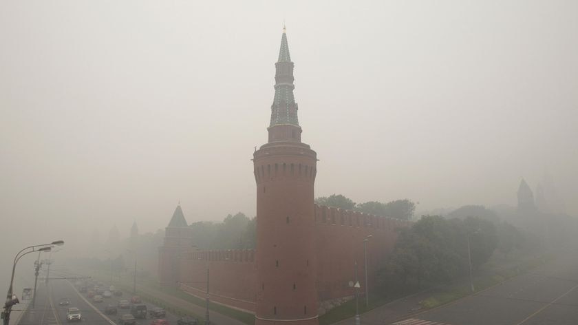 The Kremlin wall in Moscow seen through heavy smog caused by peat fires in nearby forests on August
