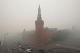 The Kremlin wall in Moscow seen through heavy smog.