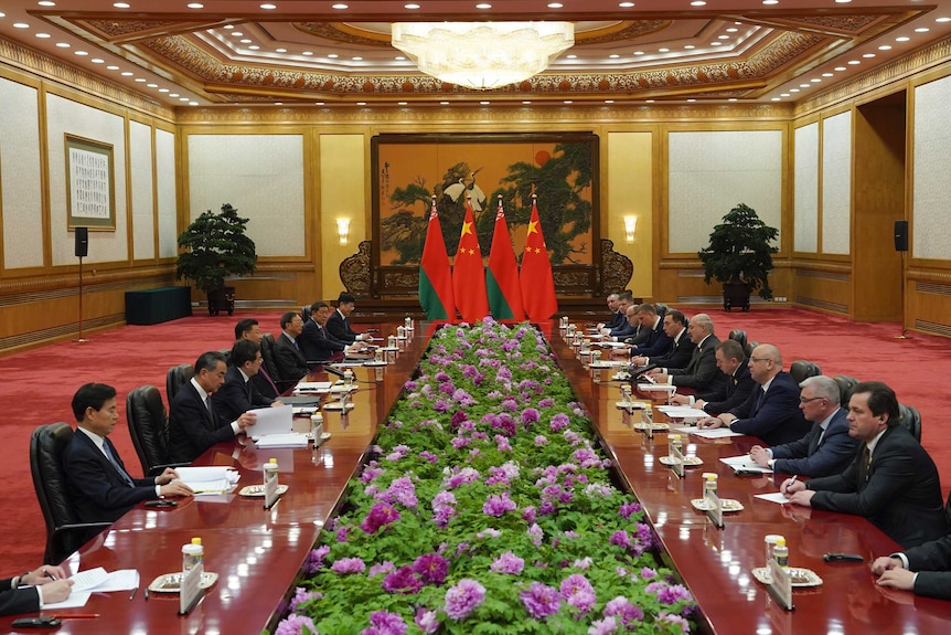 Various leaders sit around a table to discuss Belt and Road in Beijing, China.