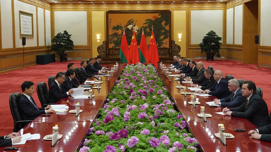 Various leaders sit around a table to discuss Belt and Road in Beijing, China.