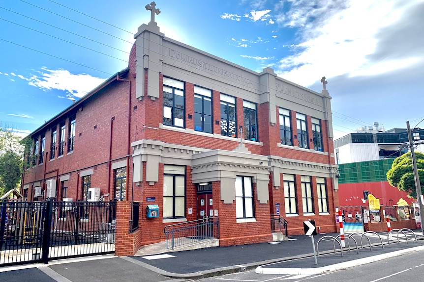 The brick building of St Michael's Primary School, photographed in morning light.