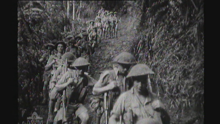 Australian troops march across the Owen Stanley Range