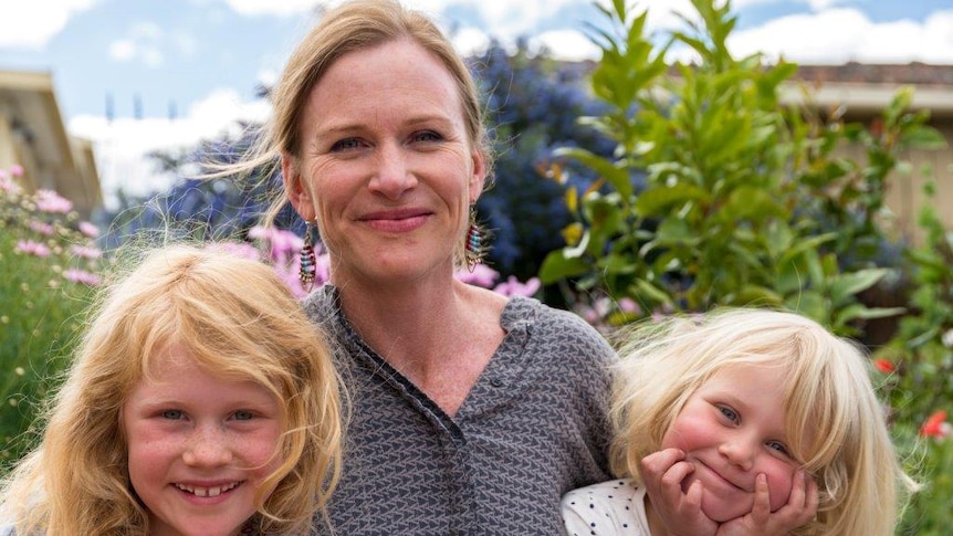 Meredith Wilson and her daughters in a garden
