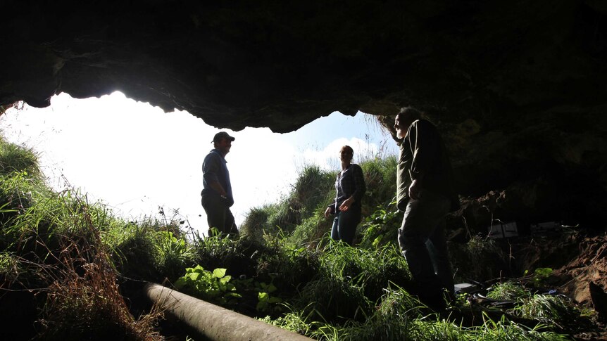 Three researchers in a Glencoe cave