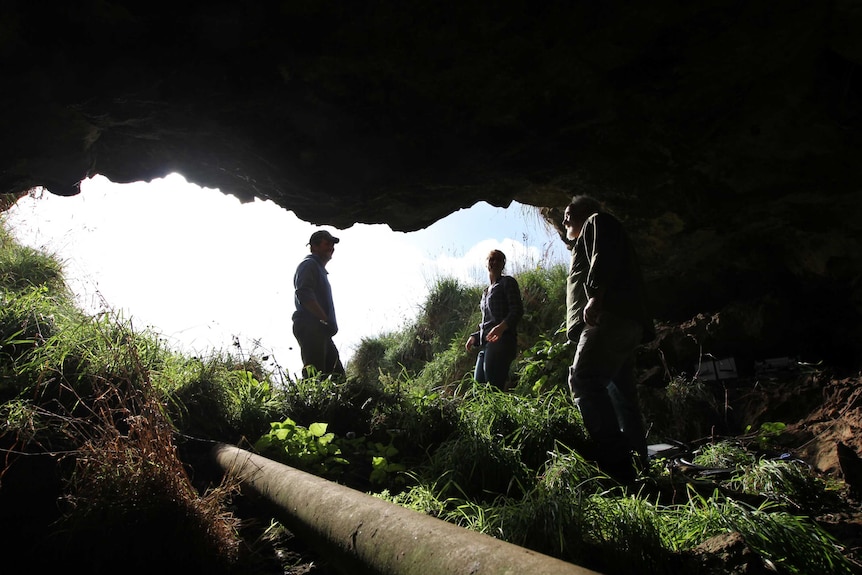 Three researchers in a Glencoe cave