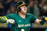 Australia's Rixon Wingrove jumps in the air next to teammate Logan Wade during the quarterfinal of the World Baseball Classic.
