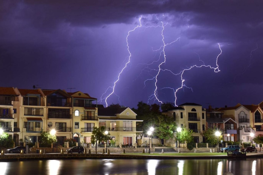 Big bolts of lightning light up a darik sky over Claisebrook Cove.