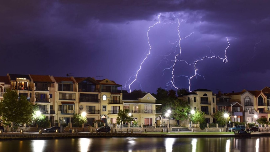 Big bolts of lightning light up a darik sky over Claisebrook Cove.