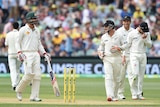 New Zealand's BJ Watling (R) speaks to Nathan Lyon after he was given not out at Adelaide Oval.