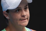 Ash Barty grits her teeth and clenches her fist