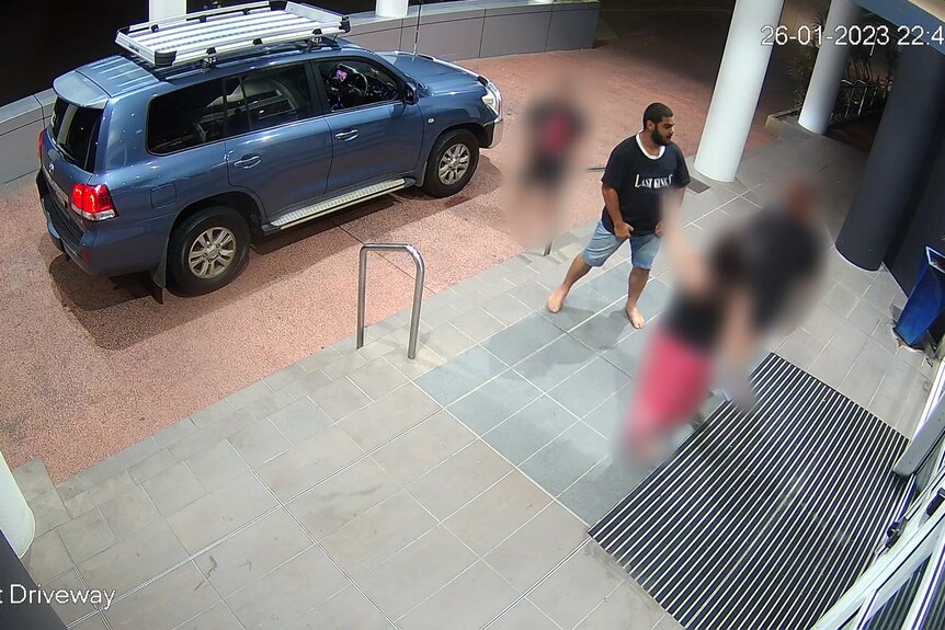 A CCTV still showing the one-punch assault outside the front doors of a hotel.
