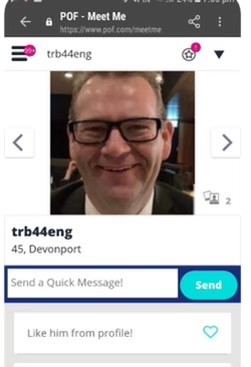 A screenshot of a dating profile with a photo of a man wearing glasses.