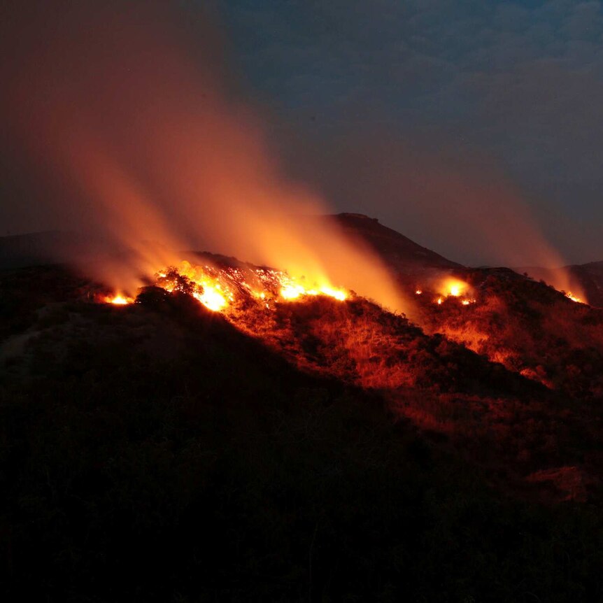 Fires burn in the La Tuna Canyon hills in Burbank, California