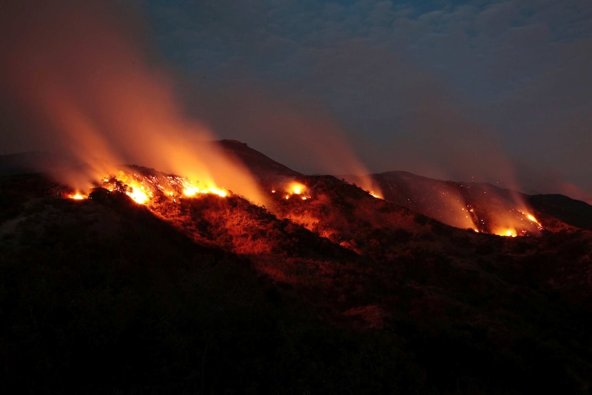 Fires burn in the La Tuna Canyon hills in Burbank, California