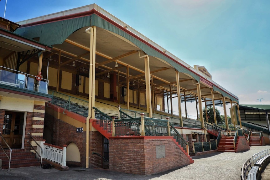A historic-looking grandstand at a showground.
